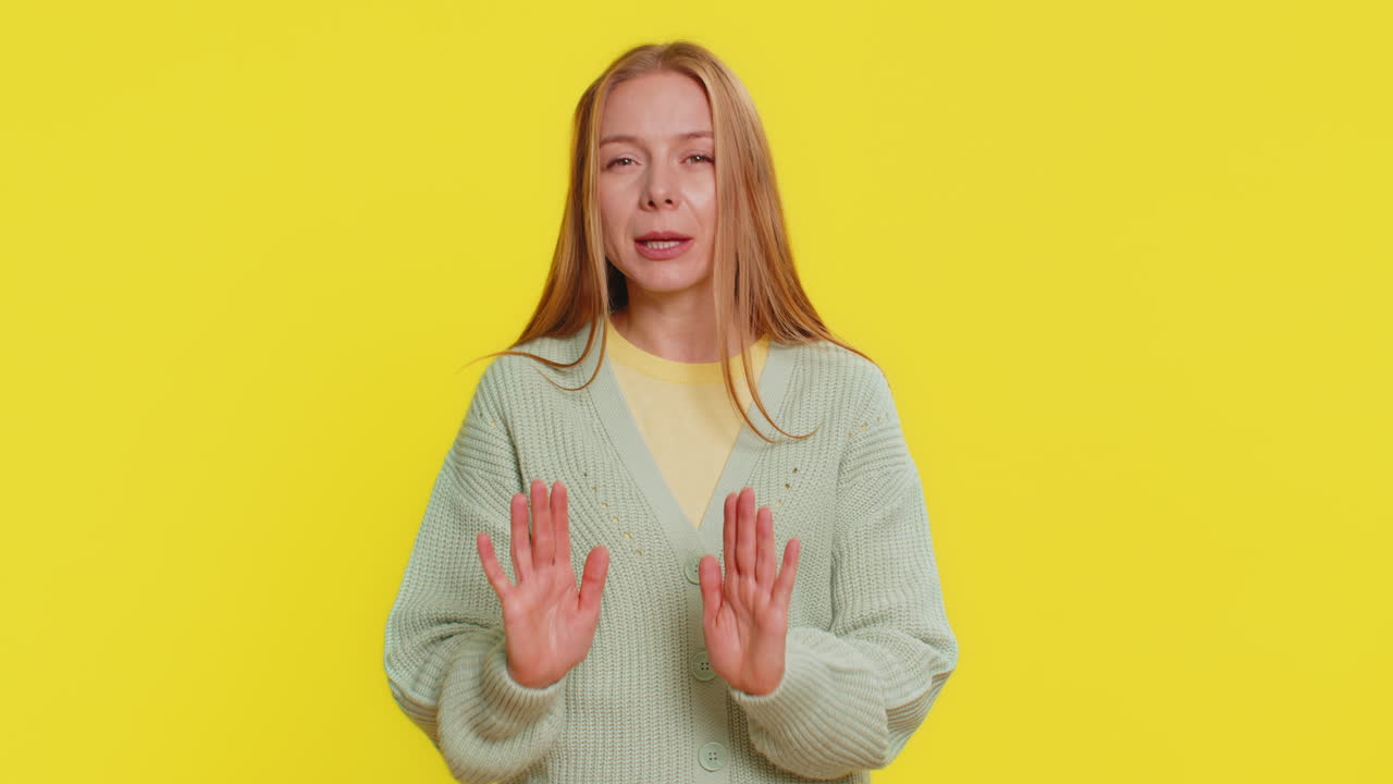 Strict mature woman warning hands gesture saying no be careful advice to avoid danger caution