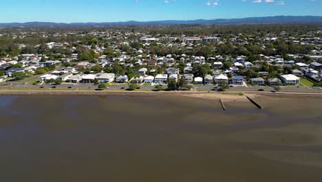 aerial view rising shot of sandgate and brighton waterfront on a sunny day, brisbane, queensland, australia