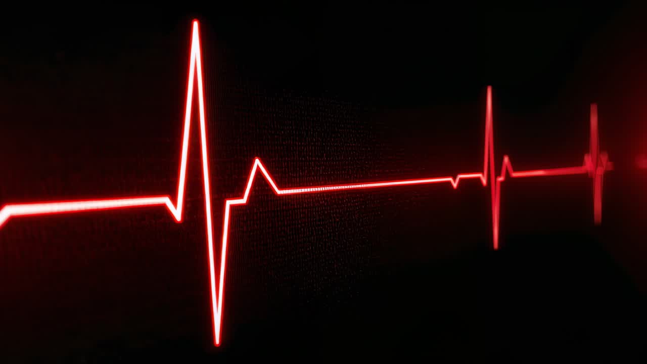 Display powering on launching red ECG trace scrolling across monitor face, repeating cardiac cycle