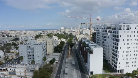 suburban street with residential buildings, establishing aerial view of tel aviv