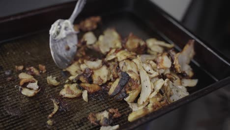 grilled pulled pork stirring with metal spoon