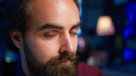 Portrait-of-man-using-professional-microphone-to-record-podcast,-close-up