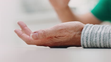 elderly person holding child's hand