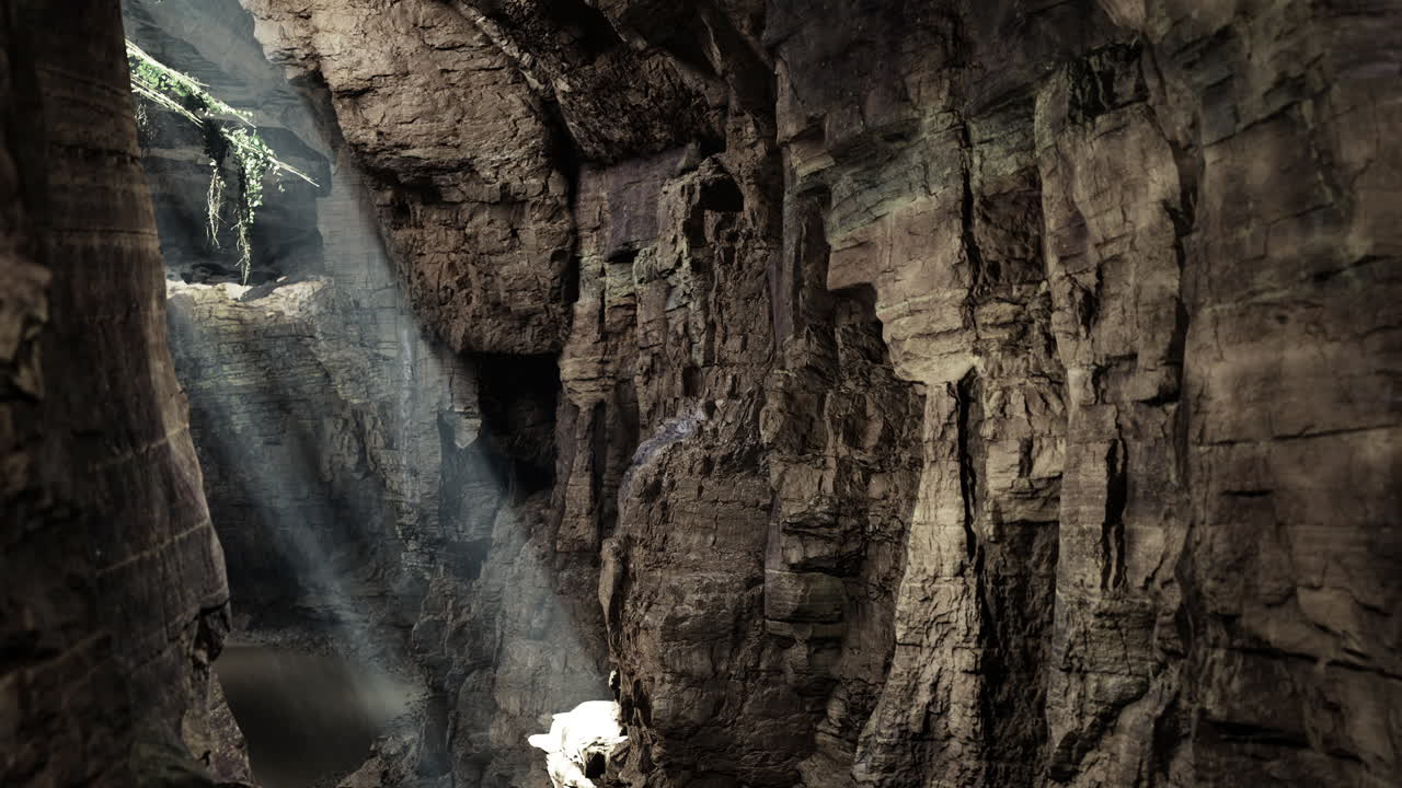 Light beams illuminate a stunning cavern during daytime exploration