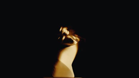 sculptural head with 3d glasses in low light