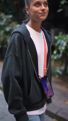 stylish woman wearing a hoodie and jeans