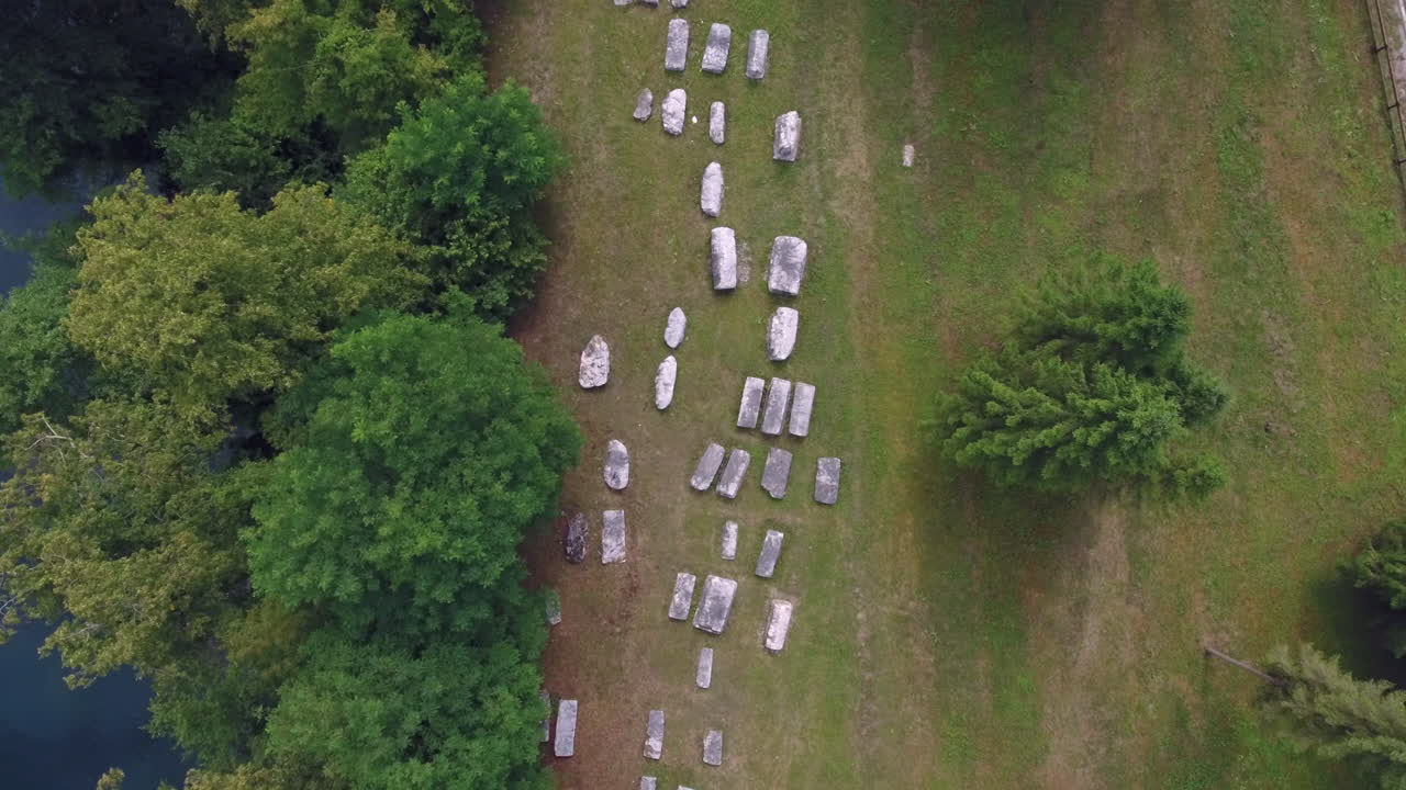 A scenic aerial view of an ancient graveyard with Drina river and the main road that follows its course, Mramorje , Serbia