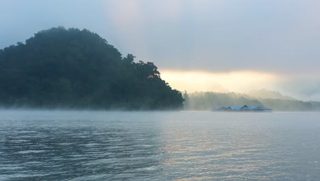 sunrise over a tranquil misty lake