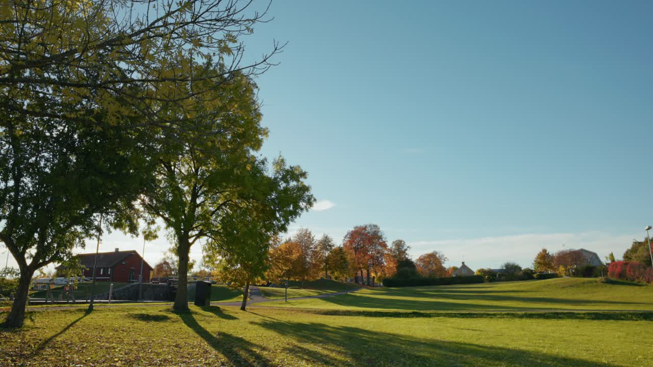 Picturesque Landscape Of Green Meadow, Trees, House In Daylight. - wide shot