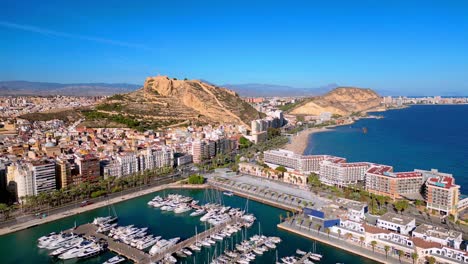 Aerial-4k-drone-footage-of-Alicante,-Spain,-the-marina-,-playa-del-postiguet-and-castillo-de-santa-barbara