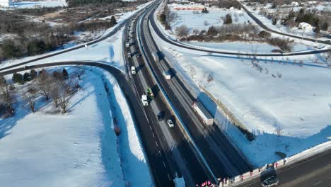 Aerial-Freedom-convoy-2022-leaving-Kingston-Ontario-Canada-with-people-supporting