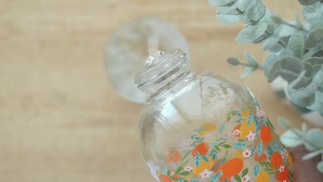 close up of a floral glass water bottle