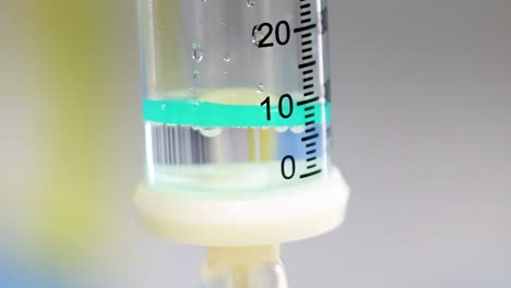 a detailed view of a liquid level in a transparent graduated cylinder with measurement markings.