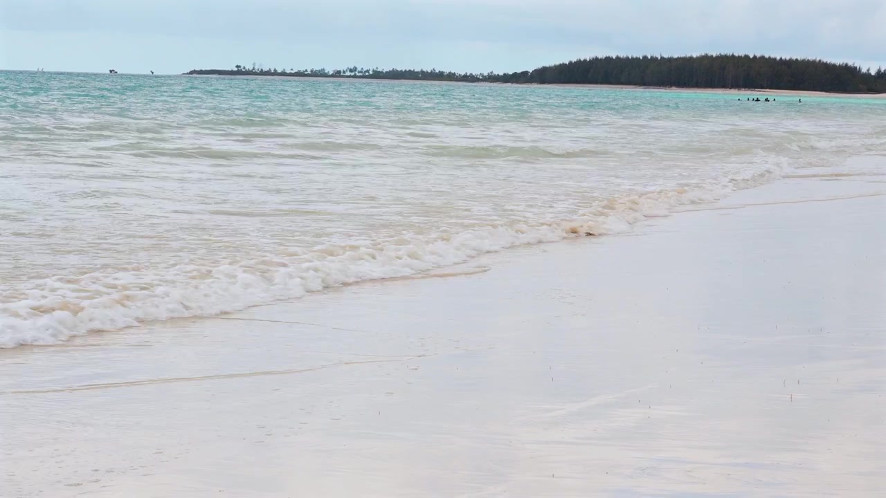 igamboni beach in Dar es Salaam Tanzania featuring golden sand ocean waves sunlight and exotic tropical coastal landscape