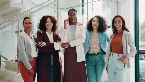 group of diverse businesswomen smiling and looking confident