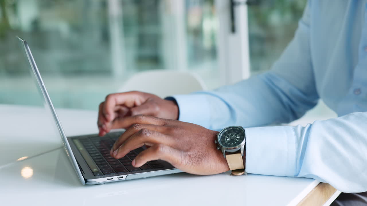 Busy, productive businessman working on laptop