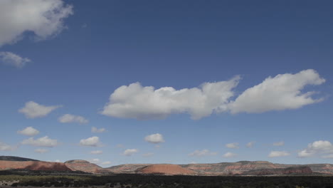 panning time lapse of winter clouds in a blue sky over the continental divide in new mexico