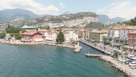 promenad from torbole in italy at lake garda with colorful houses at the waterfront