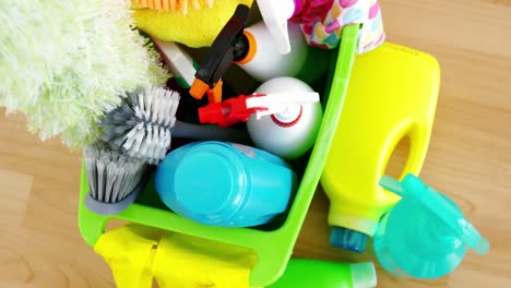 various housekeeping supplies in a bucket