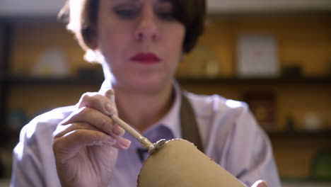 woman potting in a studio