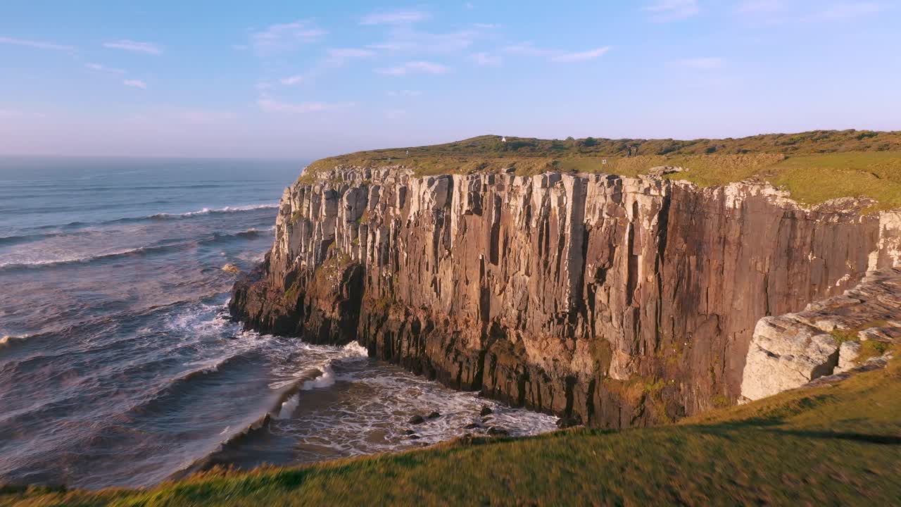 Establishing beautiful aerial cinematic shot of cliffs on atlantic ocean