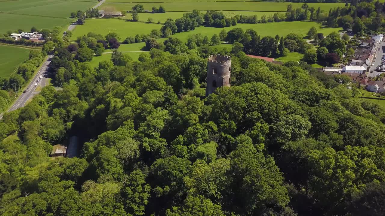 Aerial view of the Dunster Conygar tower and surrounding areas full of trees near Dunster castle, Somerset, England.