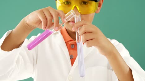 Schoolboy-doing-a-chemical-experiment-in-laboratory-4k