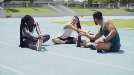 group stretching on a track