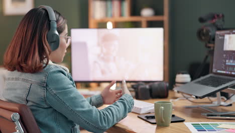woman video editor in a home office working on video footage