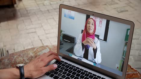 Man-having-a-video-conference-with-a-doctor