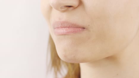 woman eating dried apple in close-up. dry fruits.