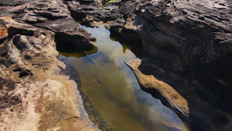 Drone-shot-skimming-Rocks-at-low-tide