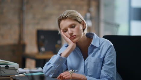 bored office girl sitting empty cabinet close up. tired woman feeling burnout