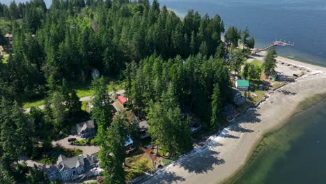 rising drone shot of herron island's private community in the puget sounds brackish waters