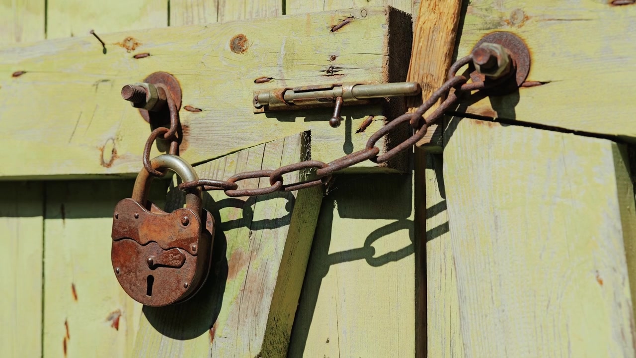Corroded security hardware reflects decades of exposure and forgotten use