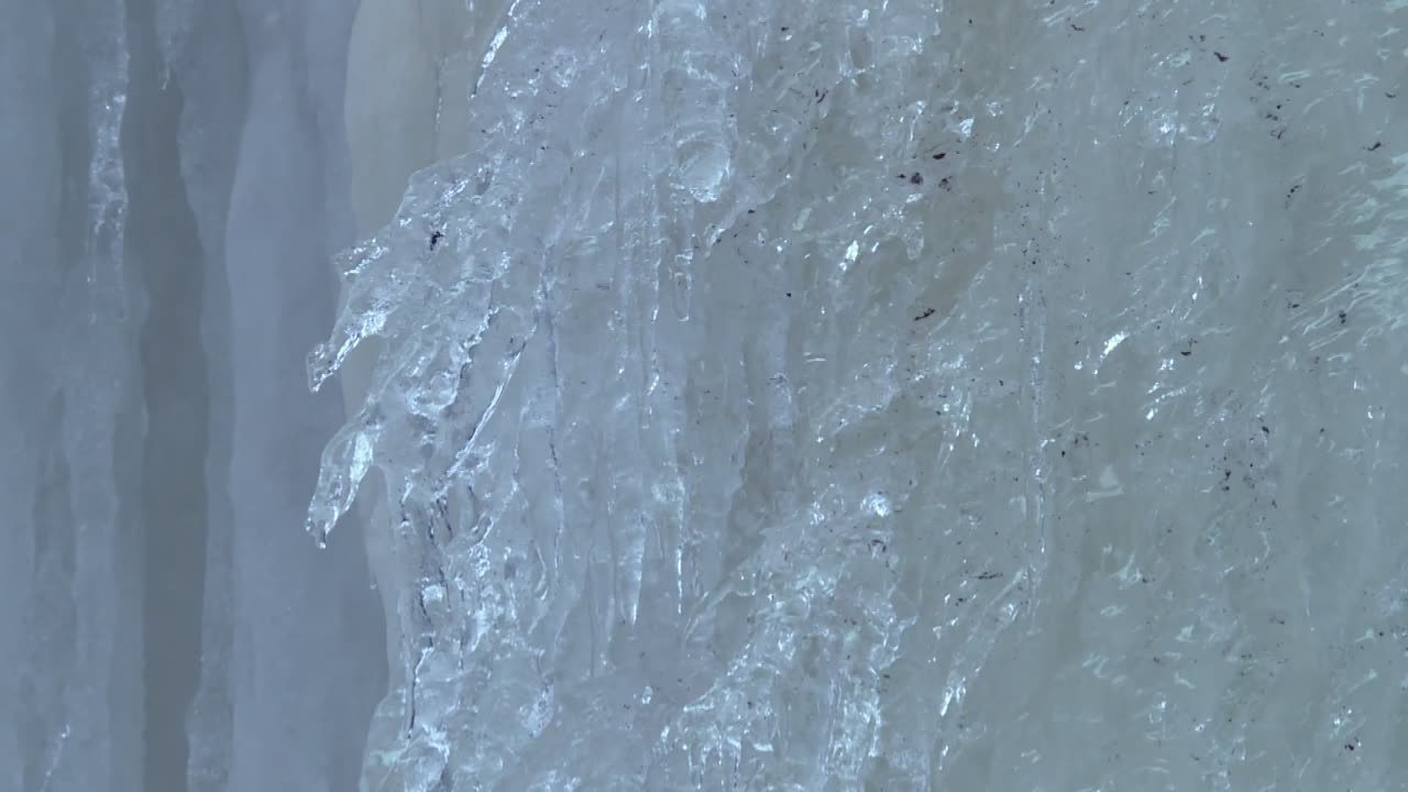 Water Drips On The Melting Ice Of Rock River Canyon Ice Caves Near Eben Junction In Upper Peninsula, Michigan. Close-up Shot