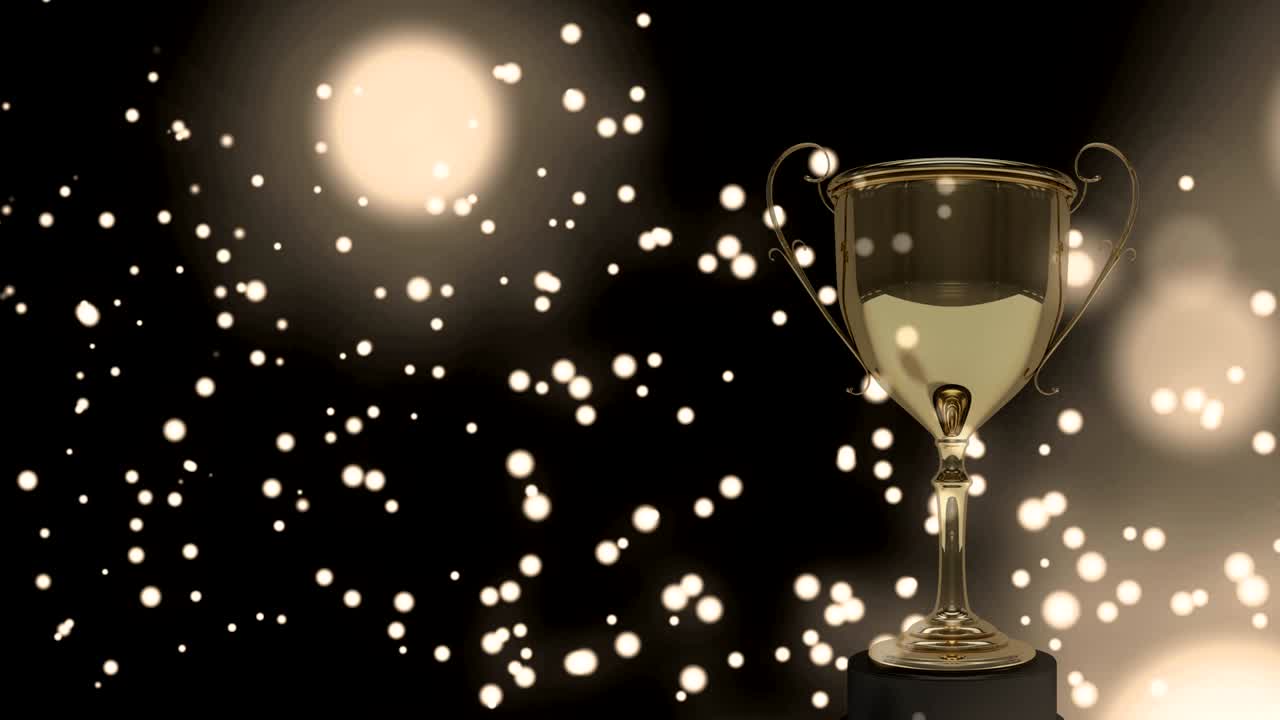 노란색 반 ⁇ 이는 반점이 황금색 트로피를 배경으로 움직입니다.