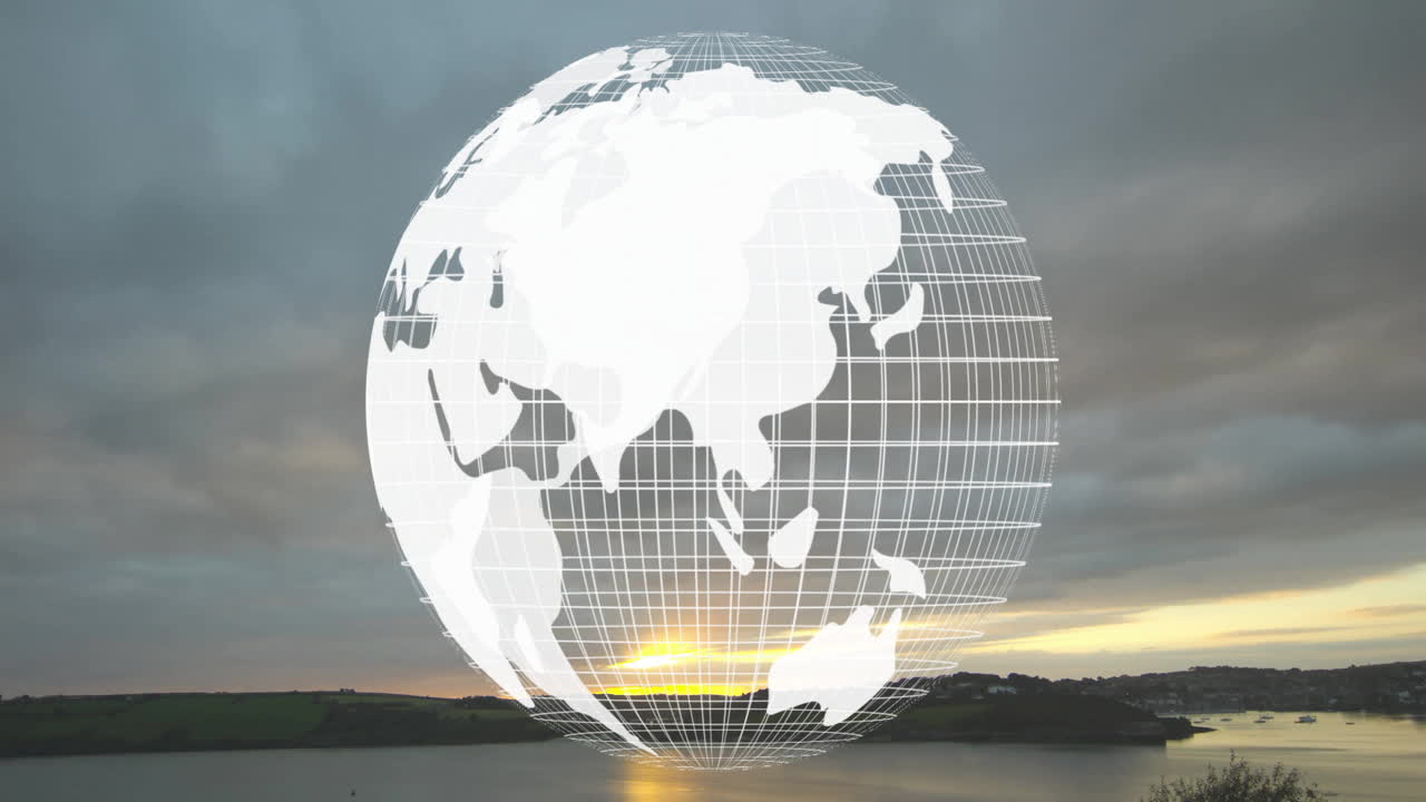 Globe animation over serene landscape with water and cloudy sky