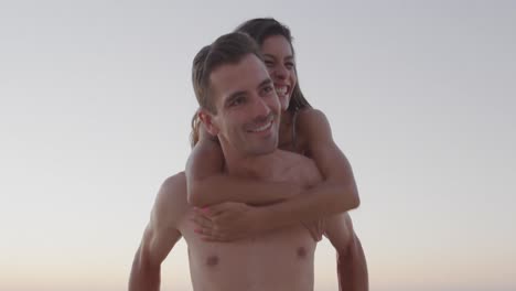 young adult couple having fun at the seaside