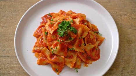 farfalle pasta in tomato sauce with parsley - italian food style