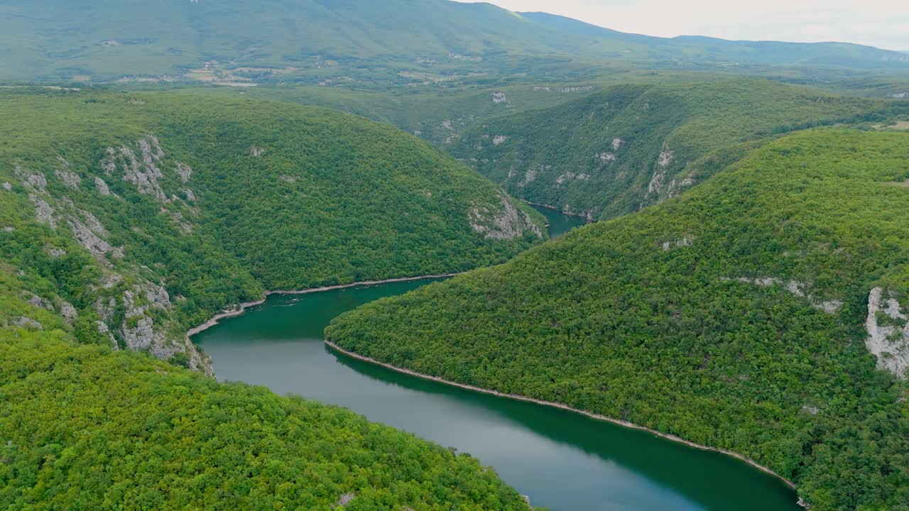 Aerial drone view of the Vrbas River in Bosnia and Herzegovina, wide angle scenic panoramic view of green valley