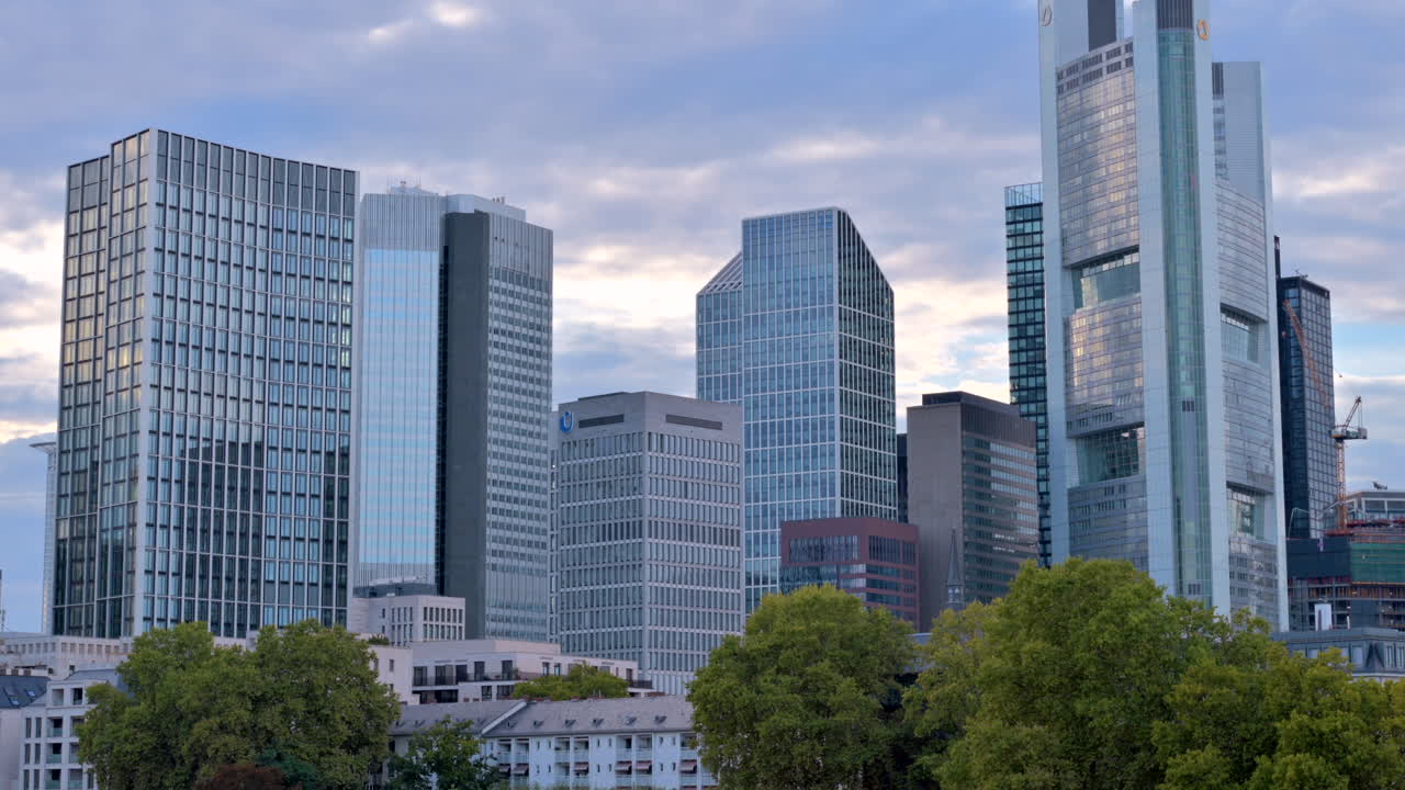 View of the skyline of Frankfurt from across river Main in the evening