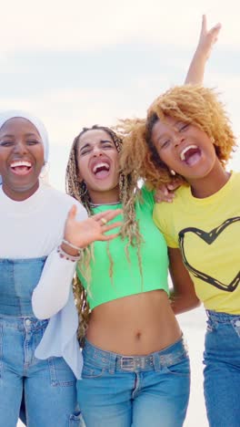 black women embracing and smiling at camera