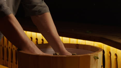 washing lettuce in a wooden tub