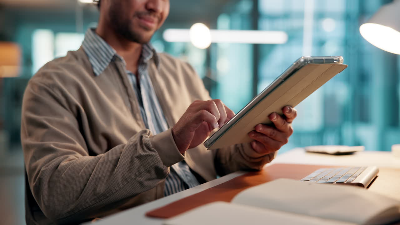 Man Using Digital Tablet at Desk in Modern Office