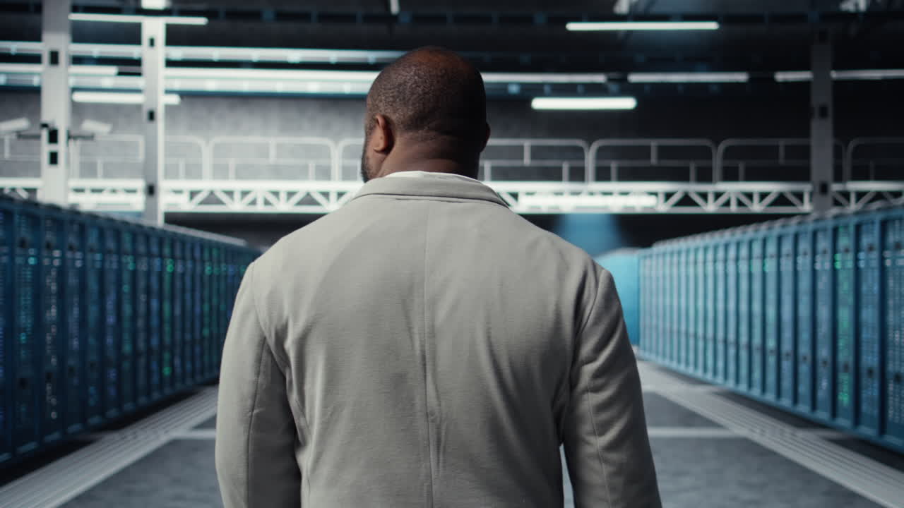 Vertical video System administrator in data center doing inspection on infrastructure tech