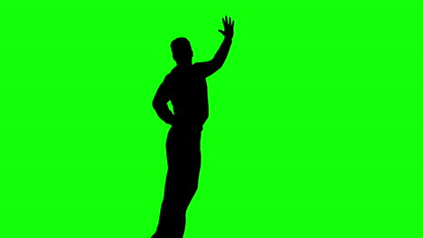 Silhouette-of-man-jumping-raising-legs-on-green-screen