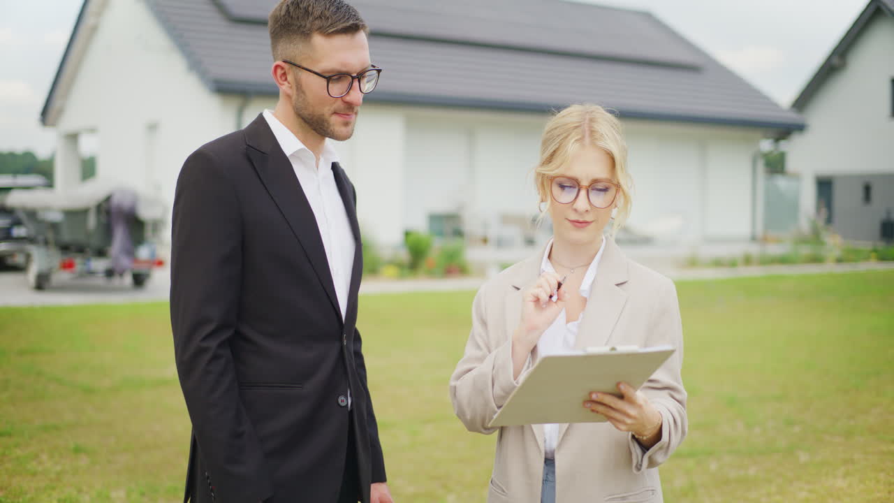 Real Estate Agent Signs Contract with Client