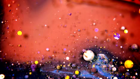 abstract colorful acrylic and food paint bubbles on water