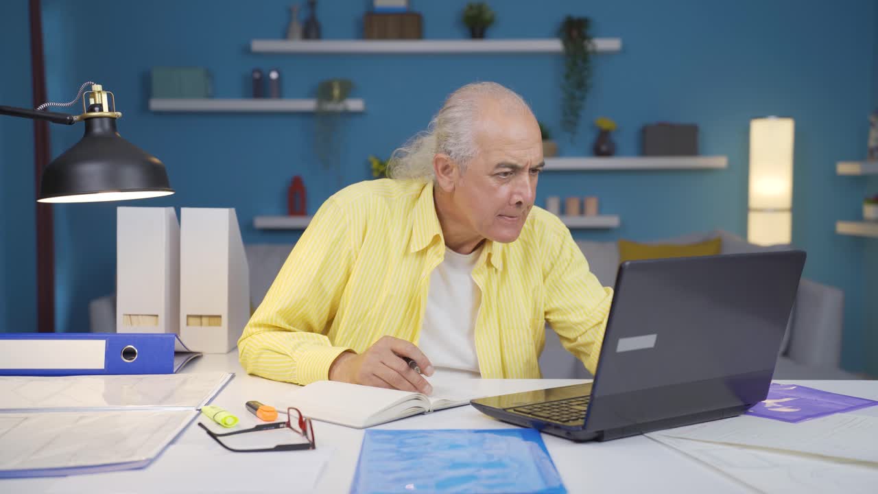 Home office worker old man doing research.